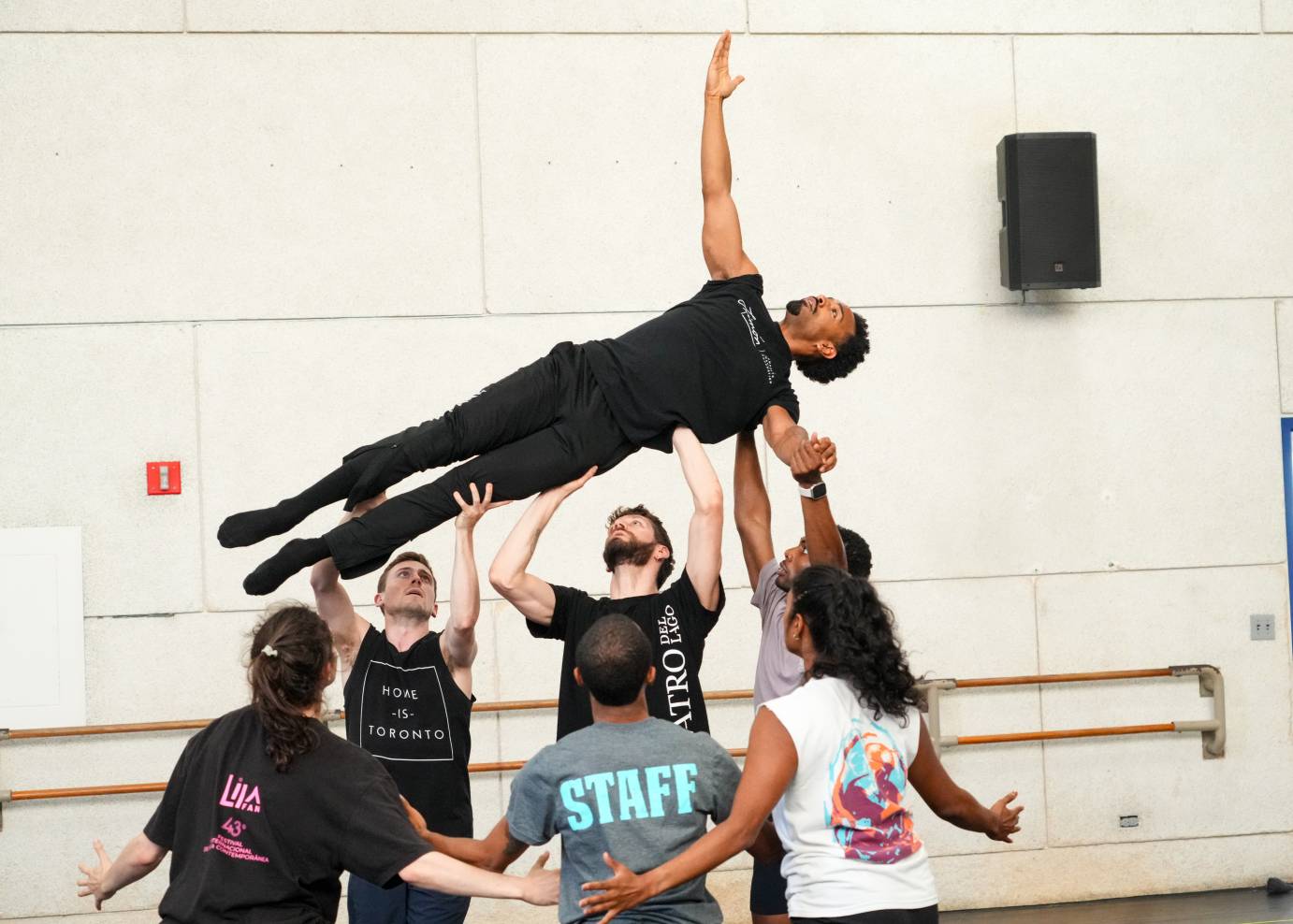 Eric P lifted above the company's heads in a flying crucifix shape