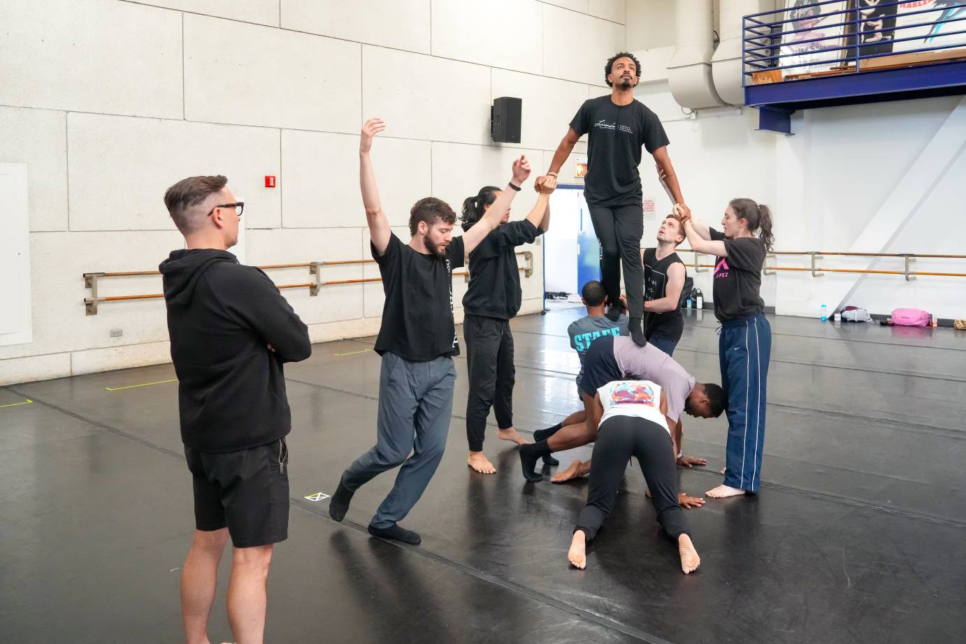 more walking lifts  practice as the artistic director looks on 