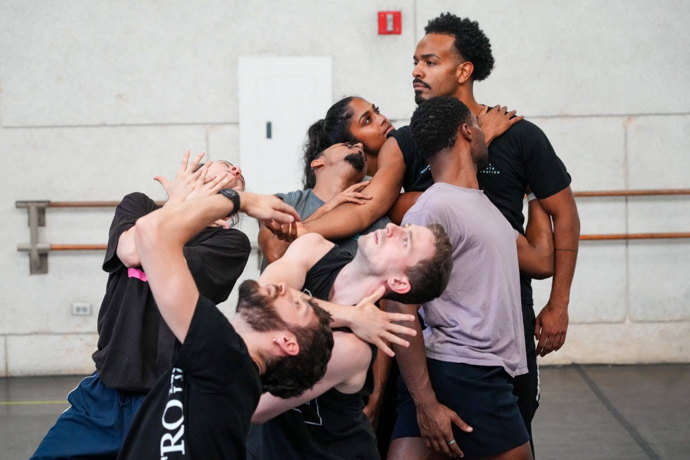 the group looking very much in awe arranged in a standing, leaning sculpture admires Eric Parra who excudes strength as their leader 